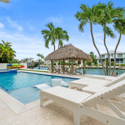 Poolside lounging with a front row seat to the water. Kayaks, sunshine and total relaxation.