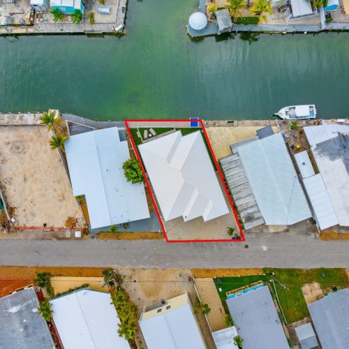 Waterfront living at its finest with private docks lining the canal, offering direct ocean access for endless boating and fishing right from your backyard.