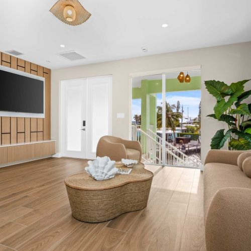 Modern lounge with warm textures and water views. Kick back after a day on the boat and stream your favorite shows on the big screen.