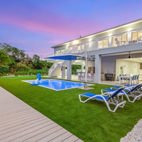 Evening glow by the pool with space to lounge, dine and hang out outdoors.