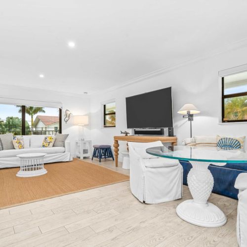 Spacious main living area with plenty of seating and water views from every angle.