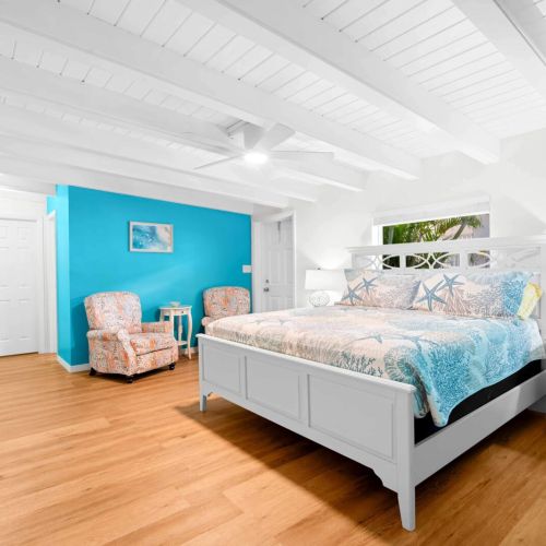 Step into your cozy retreat! This charming bedroom is a perfect blend of comfort and style, featuring a snug bed to sink into after a day of adventure and a delightful chair for those peaceful reading moments. Your home away from home awaits!