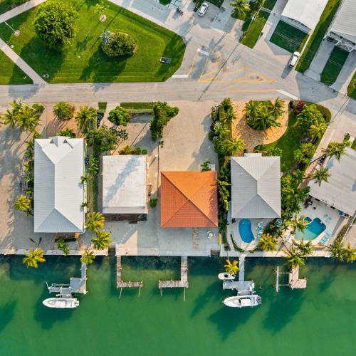 Island life — turquoise water, palm-lined canals, endless sun.