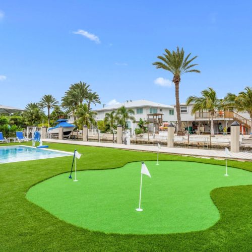 Mornings start with coffee on the dock… and “just one more round” on the putting green.