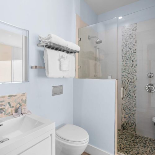 Step into your own personal oasis! This sleek bathroom features a stunning glass shower that promises to elevate your daily routine.