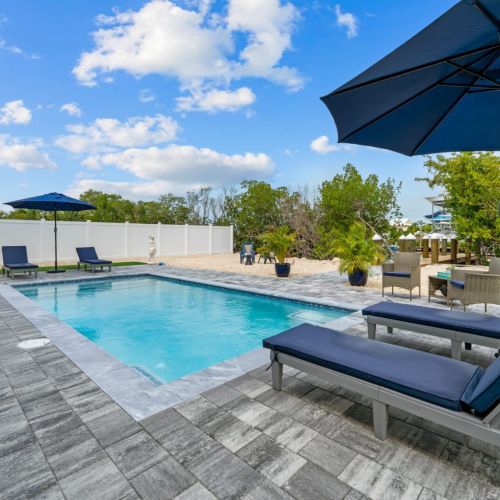 The backyard with the swimming pool is the perfect spot to relax and unwind after a day of adventure.