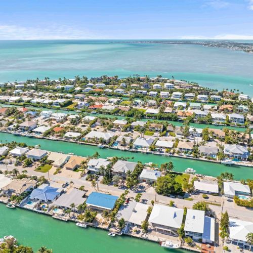 This high-angle view showcases everything from serene beaches to vibrant city life. Book your stay with us and experience this stunning landscape for yourself – adventure awaits!