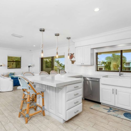 Open kitchen with water views, huge island and plenty of space for everyone to hang out while cooking.