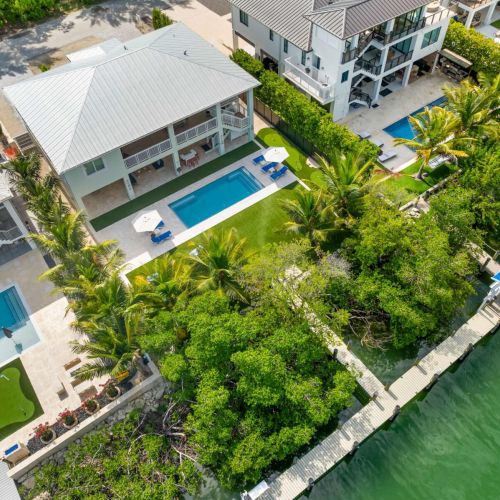 Canalfront perfection surrounded by lush palms and endless blue water. Every detail of emerald oasis is made for the keys lifestyle, swim, sunbathe, or take your boat straight from the backyard to open ocean adventure.