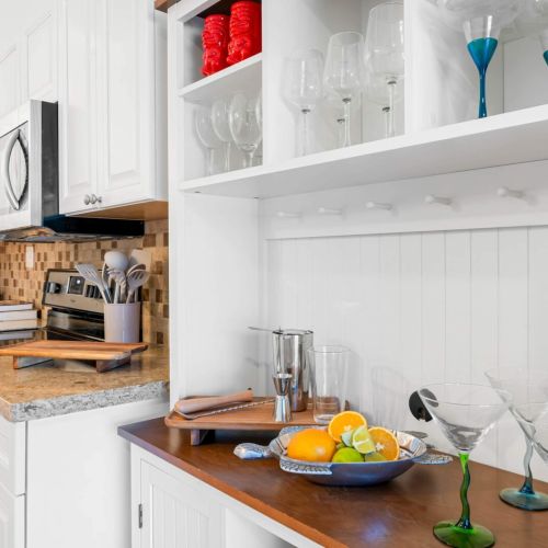 Step into this charming kitchen with white cabinets that bring a fresh and airy vibe! Whether you’re whipping up a gourmet meal or brewing your morning coffee, this space is designed for culinary adventures.