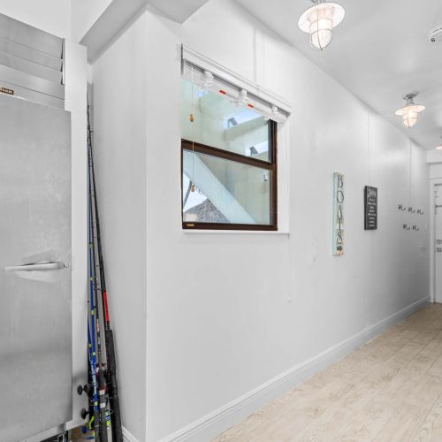 Gear up for the water. Fishing rods ready and a massive stainless fridge for all your catches.