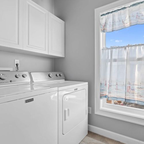 Bright, airy space with views and all you need for effortless getaway laundry!