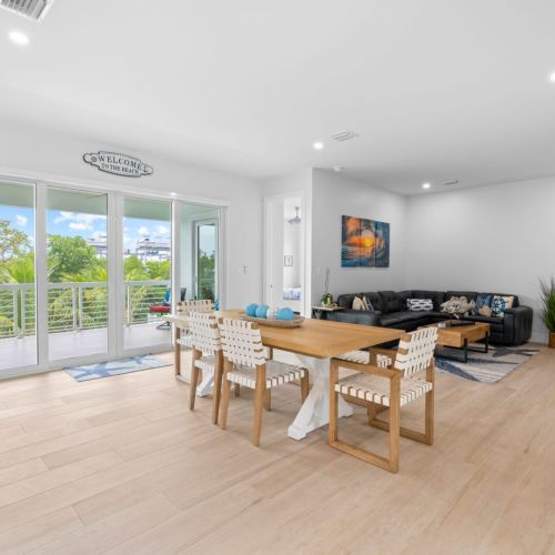 The perfect spot for relaxation in your living room with a plush couch, a sleek table, and trendy chairs.