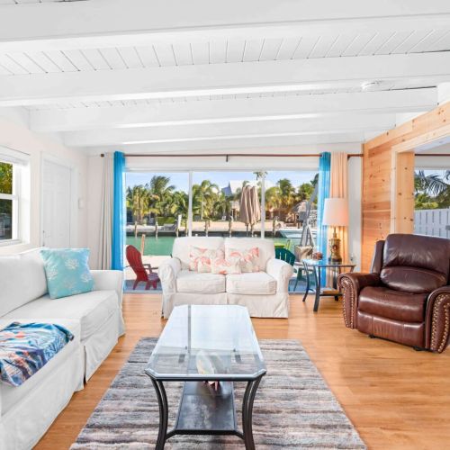 Step into luxury with this stunning living room that boasts a large window, flooding the space with natural light!