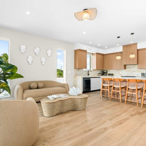 Bright open-concept living space where everyone can gather, cook, and relax together in modern comfort and style.