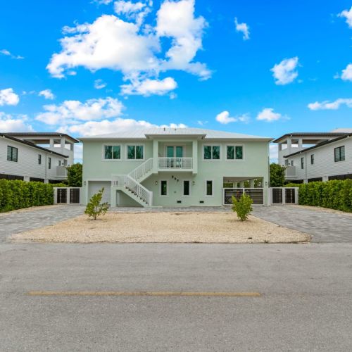 Experience the charm of this two-story home as you follow the white staircase to the upper level,