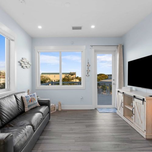 Step into relaxation in this cozy living room, where your entertainment dreams come to life!