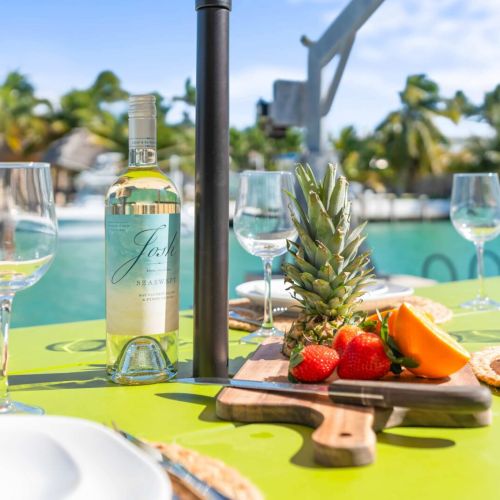 Set the perfect scene for your next getaway! Gather around this beautifully laid table, ready to serve up memories over delicious meals. Cheers to outdoor dining at its finest!