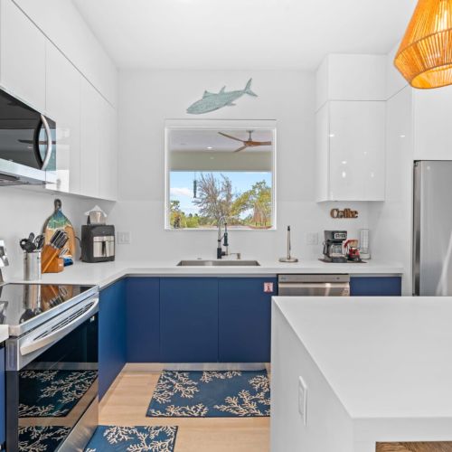 Create culinary masterpieces in the fully equipped kitchen featuring modern appliances and ample counter space.