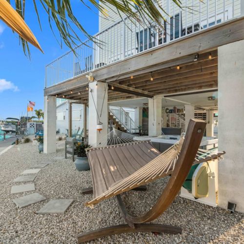 Lounge in a hammock under swaying palms, steps from turquoise waters and sunsets!