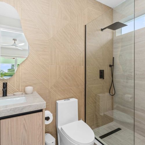 Contemporary bathroom featuring a spacious walk-in shower and elegant finishes for ultimate comfort during your stay.