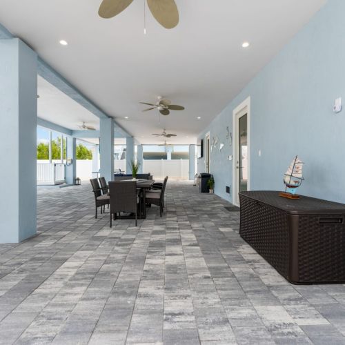 The ceiling fans will keep you cool while you unwind in the shade of the covered patio.