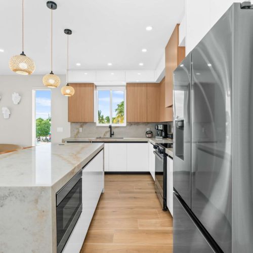 Fully equipped modern kitchen with stainless steel appliances and plenty of space to whip up your favorite island-inspired meals.