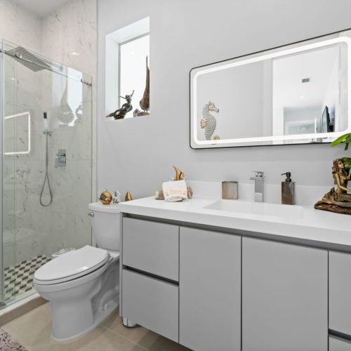 Refresh and rejuvenate in the elegantly appointed bathroom, complete with a walk-in shower.