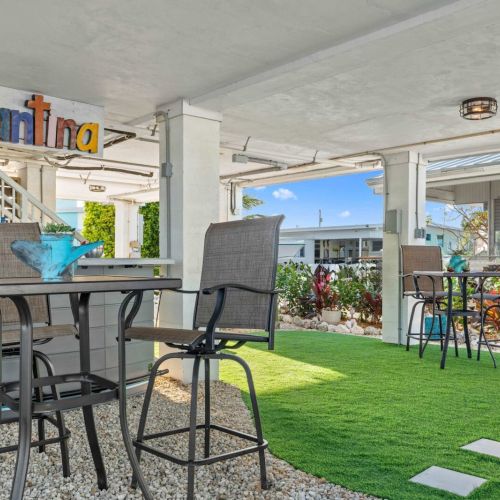 Sip tropical drinks in style amidst vibrant landscaping and easygoing island vibes!