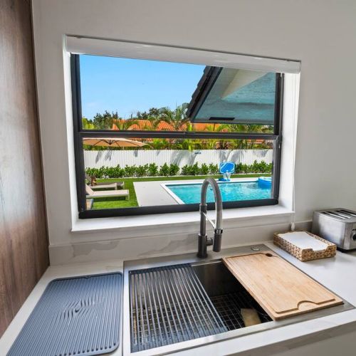 Cook with a view of the beautiful backyard.