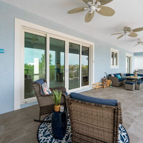 The upper-floor balcony offers another lovely space to unwind and marvel at the views.