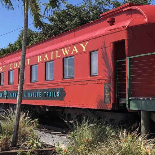 Discover the charm of our neighborhood, where a vibrant red train car awaits just a short stroll from your stay.