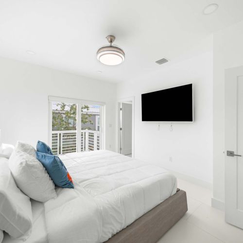 Bright bedroom with serene views and stylish decor, perfect for your getaway!