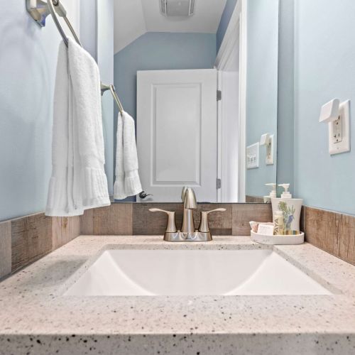 Bright oasis with stylish fixtures and tranquil blue hues for refreshing retreats!