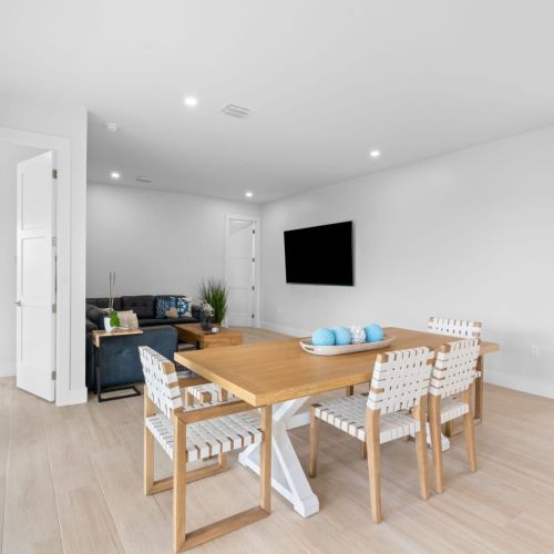 Elevate your living room space with a chic couch, a functional table, and modern chairs for the ultimate comfort and style