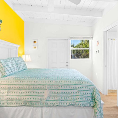 This charming bedroom invites you to relax and unwind, with a comfy bed perfectly positioned by the window for those dreamy mornings.