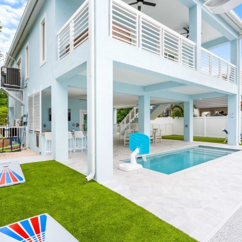 Backyard fun from sunrise to sunset — cornhole, grill, and pool all in one. Every inch designed for laid-back keys energy and easy laughter.