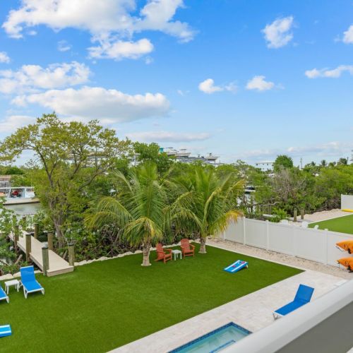 Sip a refreshing cocktail while watching the rest of the family play in the backyard.