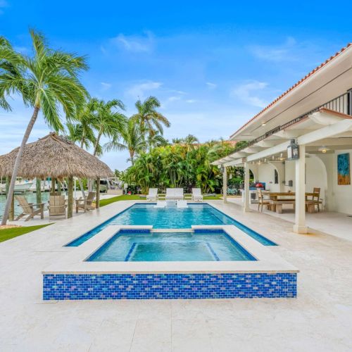 Heated pool and spa just steps from the water. Swim, soak and lounge under the palms.