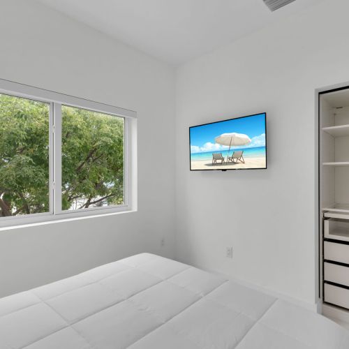 Wake up to serene views and unwind with your favorite shows on a sleek tv!