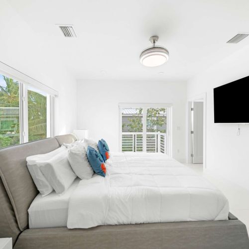 Sun-drenched elegance with plush bedding and serene views—your ideal getaway awaits!