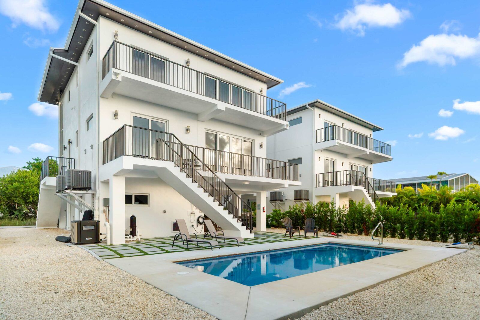 Your private slice of modern island living. Sparkling pool, sleek design, and endless sunshine just steps from the water.