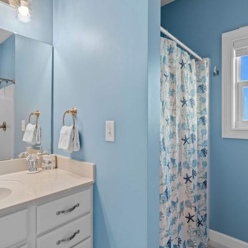 Refresh in a tranquil blue sanctuary adorned with coastal charm and sunshine!