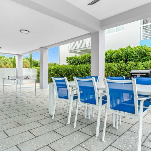 Grill, eat, play. This shaded hangout becomes the crew’s go-to spot between swims and cocktails.