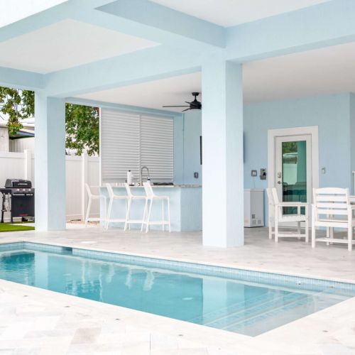 Poolside perfection framed by ocean hues. Cool off, grill, and lounge in a space built for sunshine, easy mornings, and slow keys afternoons.