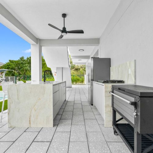 Fresh air, cold drinks, and the pool just steps away. This is where everyone ends up hanging out.