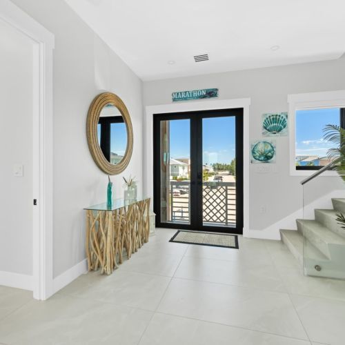 The beautiful foyer greets you as soon as you enter the home.