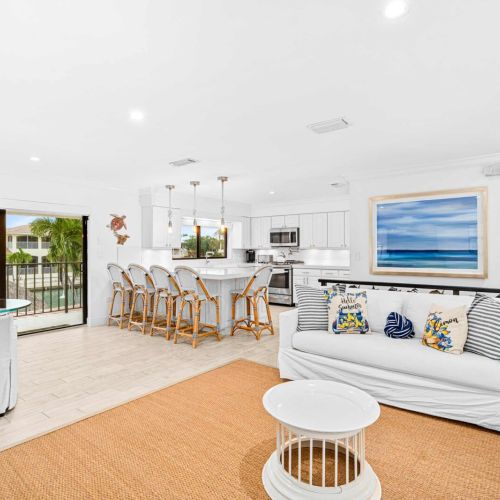 Bright, open-concept living. Slide the doors open and let the ocean breeze take over.