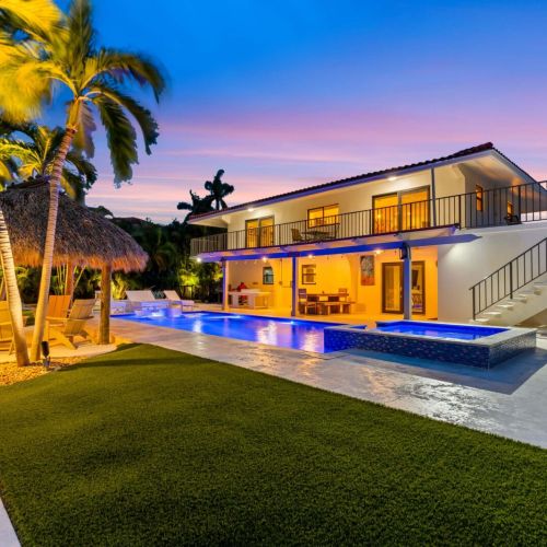 The backyard turns into a private oasis at night, perfect for late swims and quiet nights by the water.