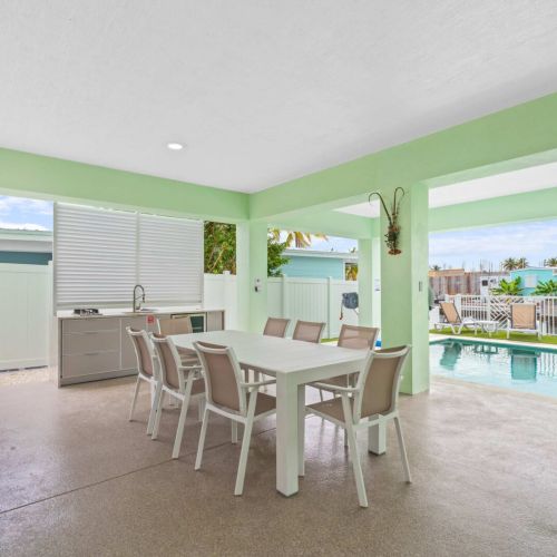 Poolside dining with shade and a breeze. Fire up the grill, eat outside, and jump in the pool whenever you feel like it.